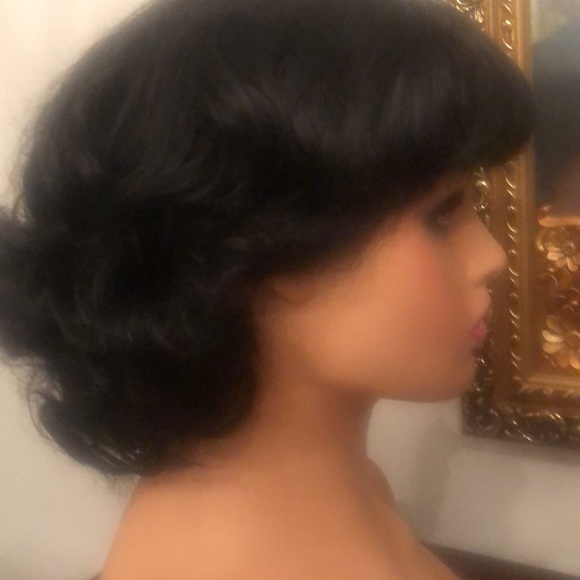 Medium length black wig with bangs